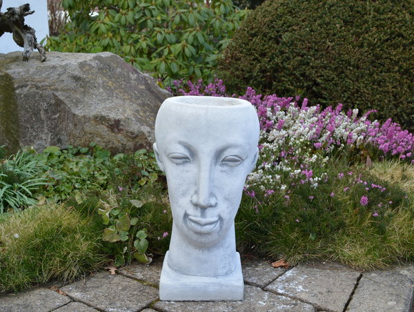 Flower pot in the shape of a head
