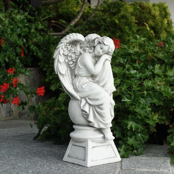 Dreaming angel on pedestal