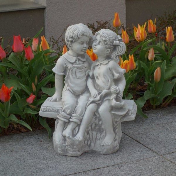 Girl and boy figures on the bench