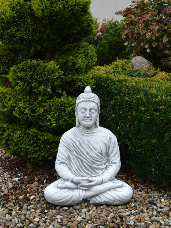 Huge Buddha statue adorns the garden or terrace