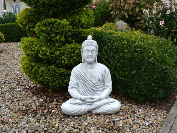 Huge Buddha statue adorns the garden or terrace