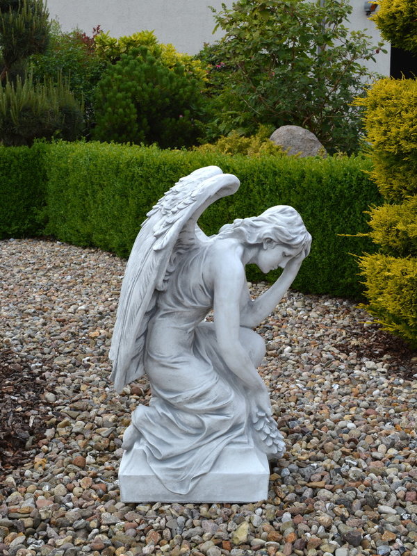 Large angel statue on base
