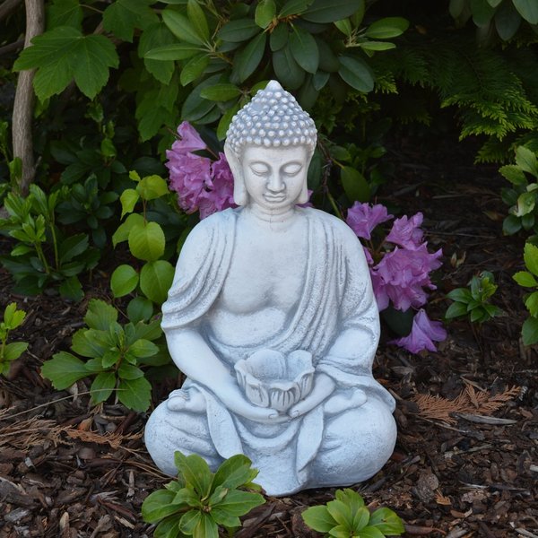 Buddha figure with a bowl in his hands