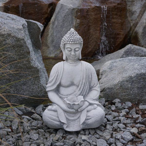 Buddha figure with a bowl in his hands