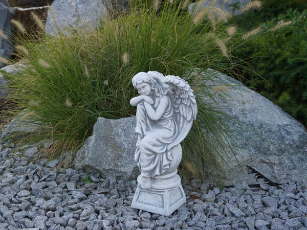 Angel on pedestal facing left