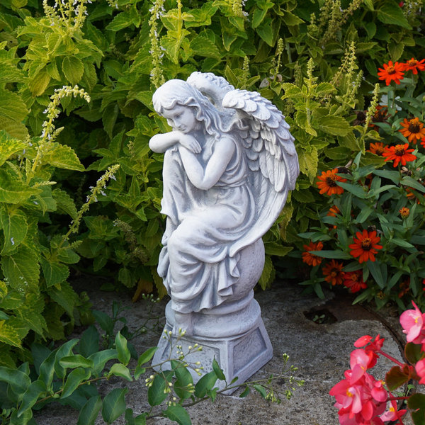 Angel on pedestal facing left