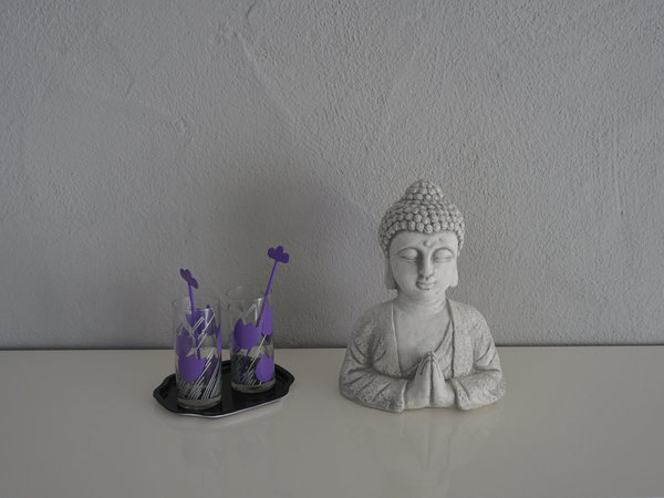 Buddha bust with namaste gesture